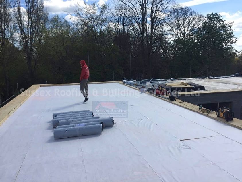 Large commercial flat roof installation underway by SRB Services.