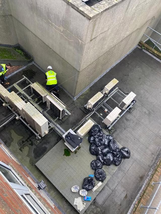 SRB team working on a commercial flat roof with plant and equipment in place.