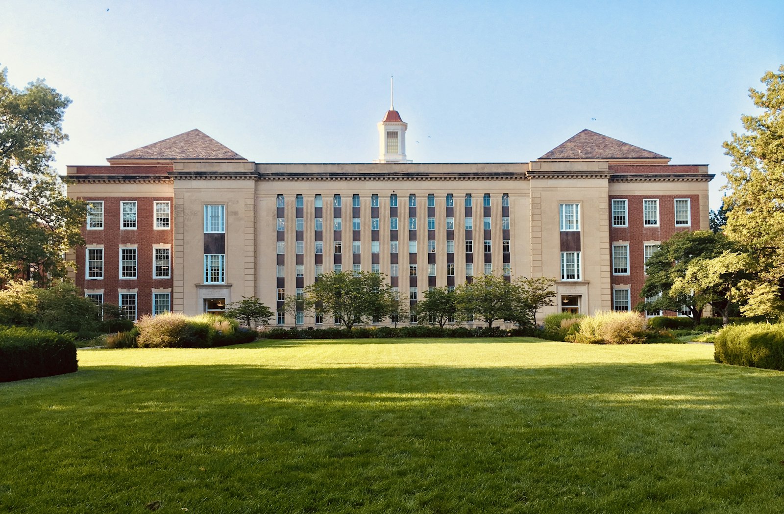 School building exterior with lawned grounds.