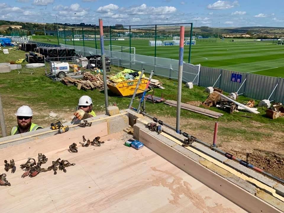 SRB crew delivering roof works on a live commercial sports facility.